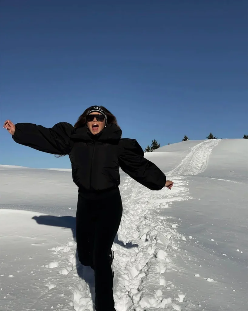 Dr. Moy celebrating in the mountains